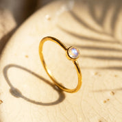 Mother and child wearing moonstone ring, meaningful June birthstone jewelry gift
