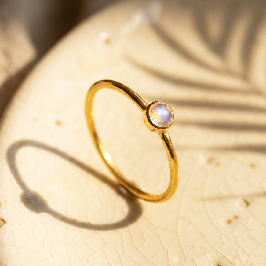 Mother and child wearing moonstone ring, meaningful June birthstone jewelry gift
