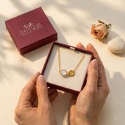 Personalized moonstone initial necklace presented inside a Danique Jewelry gift box.
