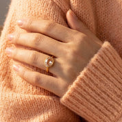 Morganite ring worn on hand, dainty oval bezel pink gemstone stacking ring for women