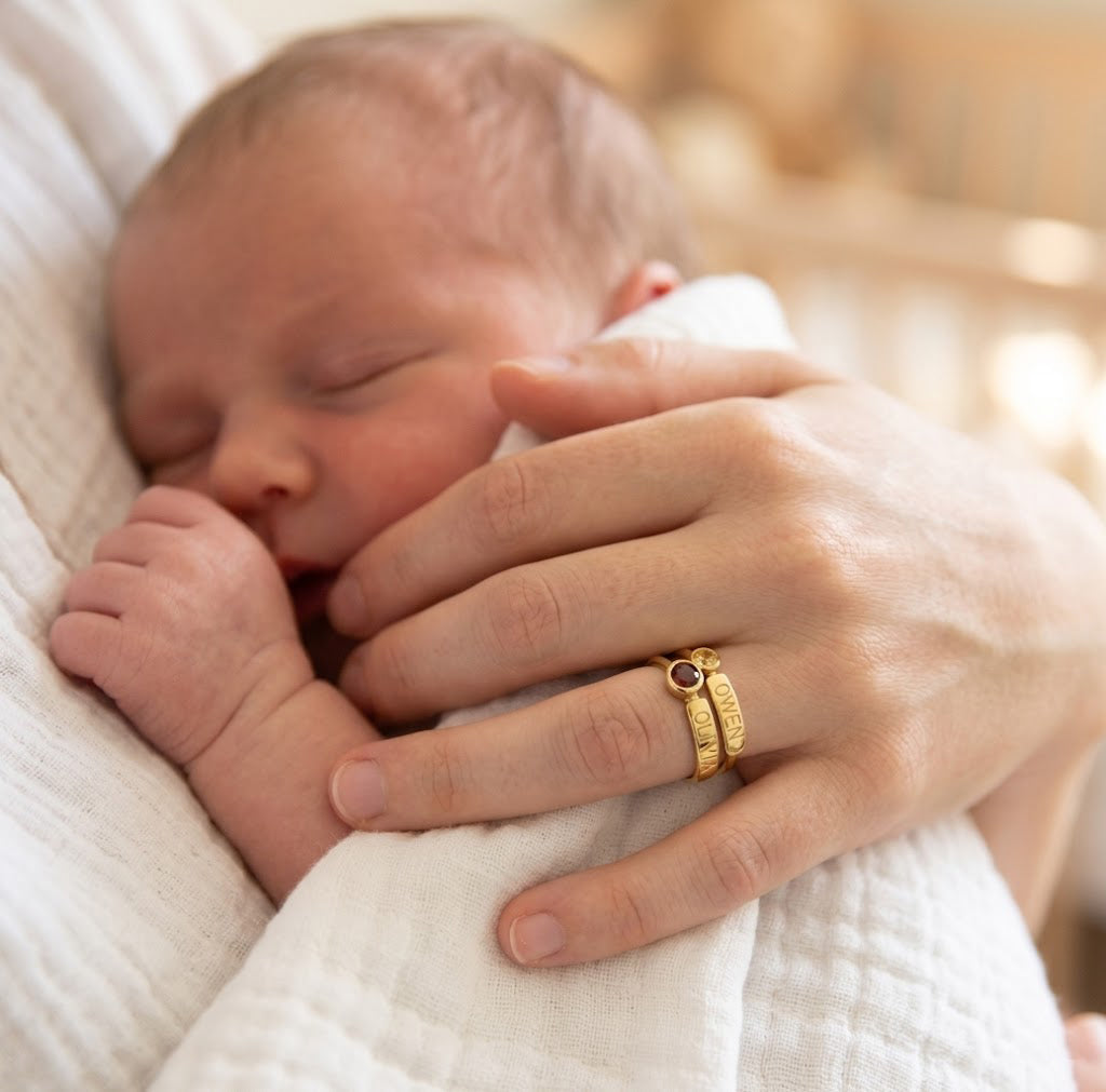 mother wearing personalized birthstone ring with baby, meaningful mom jewelry gift with kids names and birthstones
