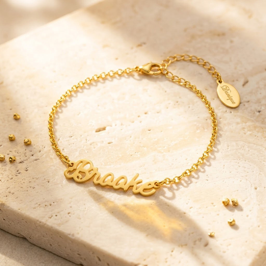 gold name bracelet on wrist custom script nameplate bracelet personalized jewelry gift for her
