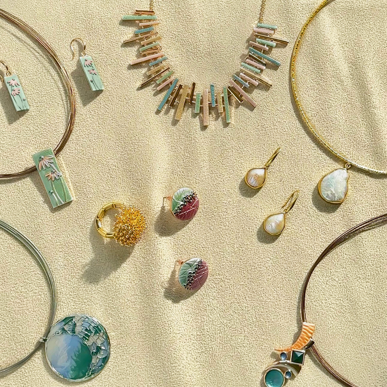 Overhead image of custom summertime bohemian chic jewelry collection set. Personalized colors available. Perfect gift for women, anniversary gift, birthday gift, women's gift, unique jewelry gift for artsy girls, custom statement jewelry, handmade jewelry for women, birthday gift for her, unique earrings, unique necklaces, art inspired jewelry, pearl jewelry, pearl earrings, pearl necklace, collar style necklaces, custom colors necklaces for women, gift for mom on mother's day, gift for mom