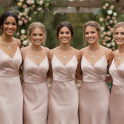 Bridesmaids wearing matching opalite teardrop necklaces in a wedding setting, showcasing perfect bridal party jewelry and coordinated gemstone accessories. Ideal for bridesmaid proposal gifts, wedding day jewelry, personalized bridal gifts, and matching opalite gemstone necklaces that create a cohesive and elegant bridal party look with minimalist gold accents.