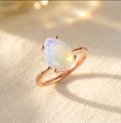 Opalite teardrop prong ring in rose gold vermeil, an October birthstone ring with a soft iridescent pear gemstone for a birthday gift or stacking ring.