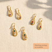Matching teardrop birthstone earrings with faceted gemstones, available to pair with the custom mom necklace.