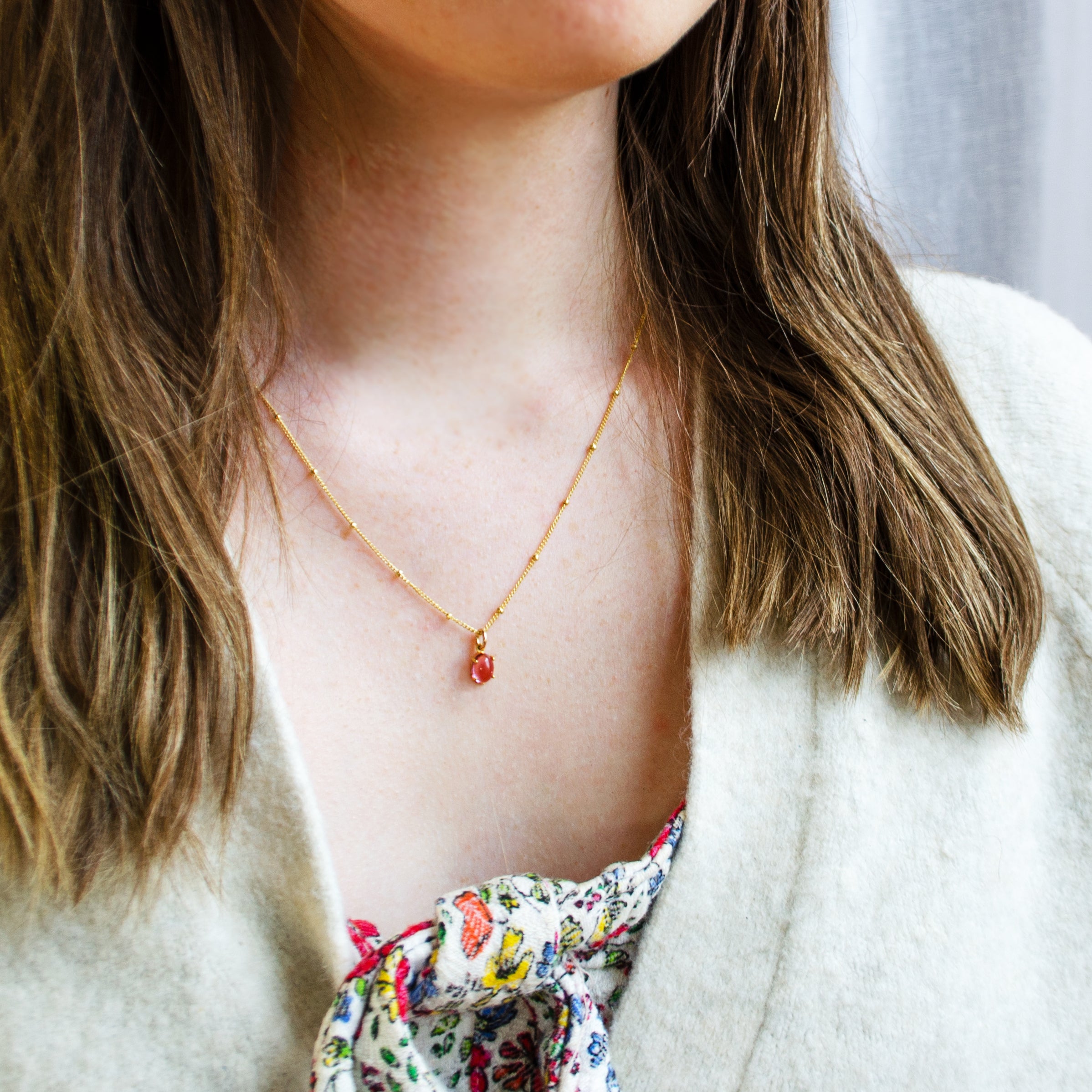 oval-birthstone-prong-necklaces-on-person.jpg