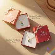 Custom oval birthstone bezel pendant necklaces shown in two sizes, smaller 5x7 mm and larger 8x12 mm, displayed in Danique Jewelry gift boxes. Personalized birthstone necklace available for all months including January garnet, February amethyst, March aquamarine, April diamond, May emerald, June moonstone or alexandrite, July ruby, August peridot, September sapphire, October opal or tourmaline, November citrine or topaz, and December turquoise or blue topaz, perfect birthday and meaningful gift.