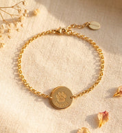 Gold paw print anklet with engraved round pet disc and adjustable extender chain
