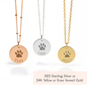 Sterling silver, gold-filled, and rose gold-filled engraved disc necklaces, each personalized with an actual paw print and pet name, custom pet memorial jewelry keepsakes for honoring the memory of beloved pets.