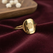 Custom engraved paw print gold plated ring with name peanut. Great gift for dog mom or dog dad for gotcha day, birthday or anniversary.