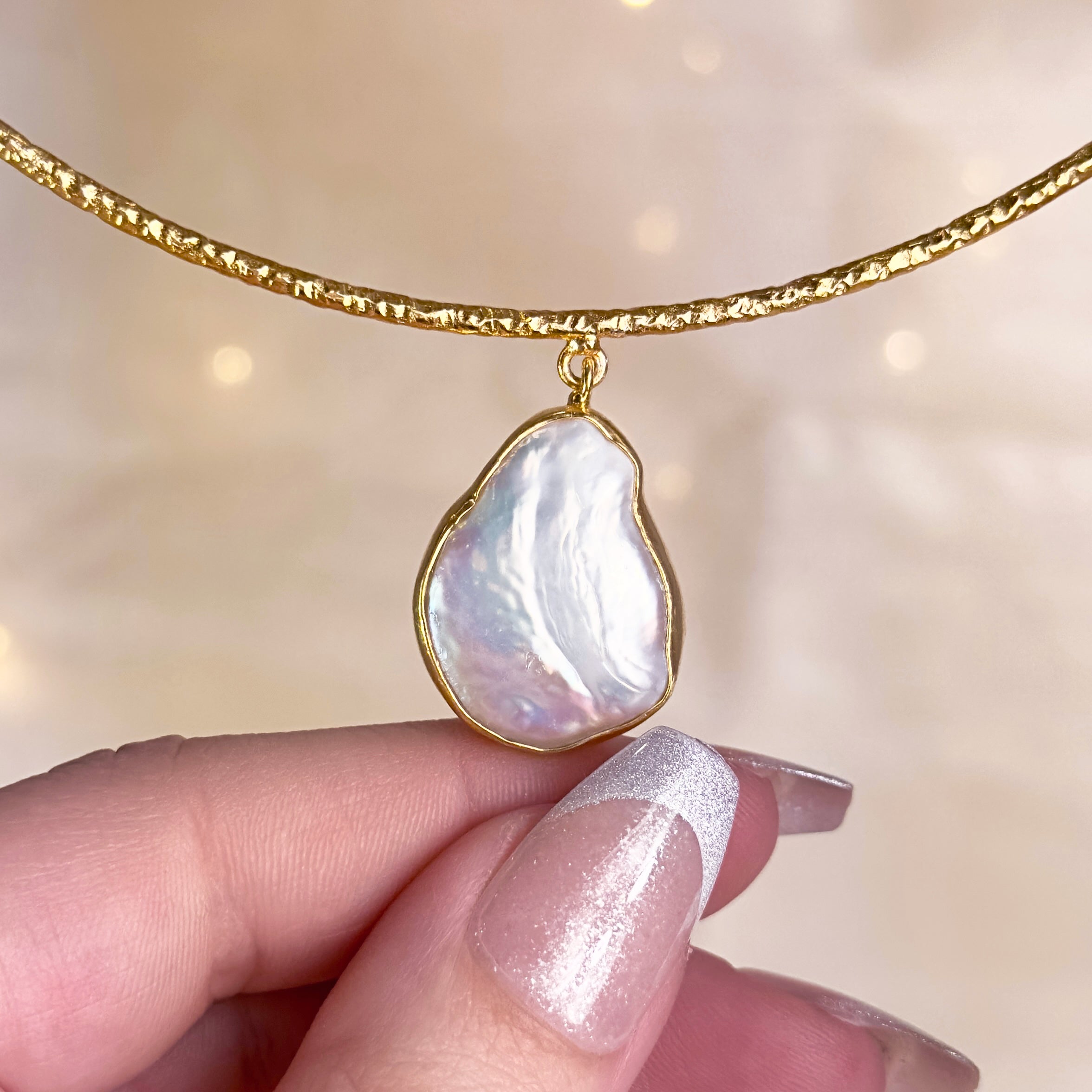 model holding Boho Gold Mother of Pearl Teardrop Choker Necklace. pearl pendant, pearl earrings, pearl necklace, boho jewelry, statement earrings, statement necklace, pearls, bohemian jewelry