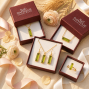 Peridot Quartz jewelry set displayed in Danique Jewelry gift boxes with flowers