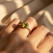 eridot quartz ring shown on model, dainty oval birthstone ring in gold for August birthday gift