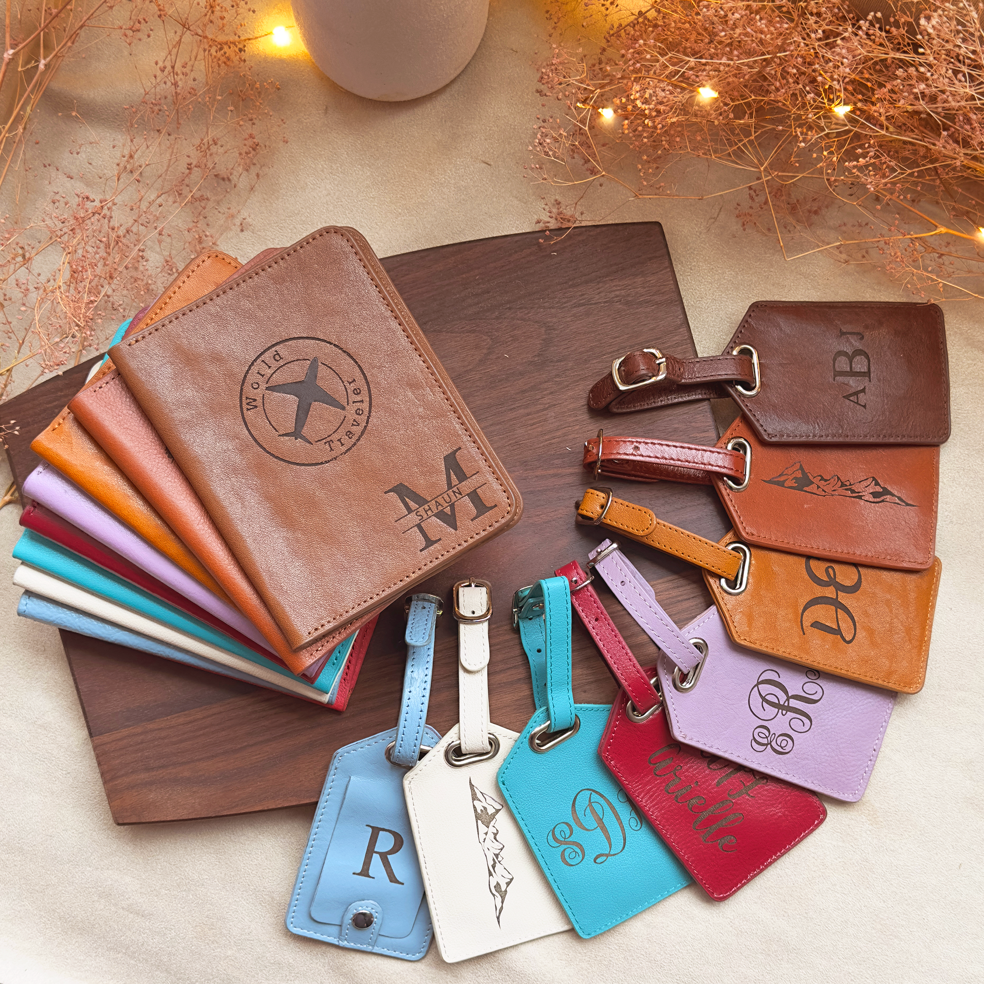 A photo of personalized passport holders and a fan of matching corresponding luggage tags. Personalized travel gifts, handmade travel gifts, custom leather gift for him, custom gift for her, personalized traveler accessories, brown, red, blue, purple, white leather for travel