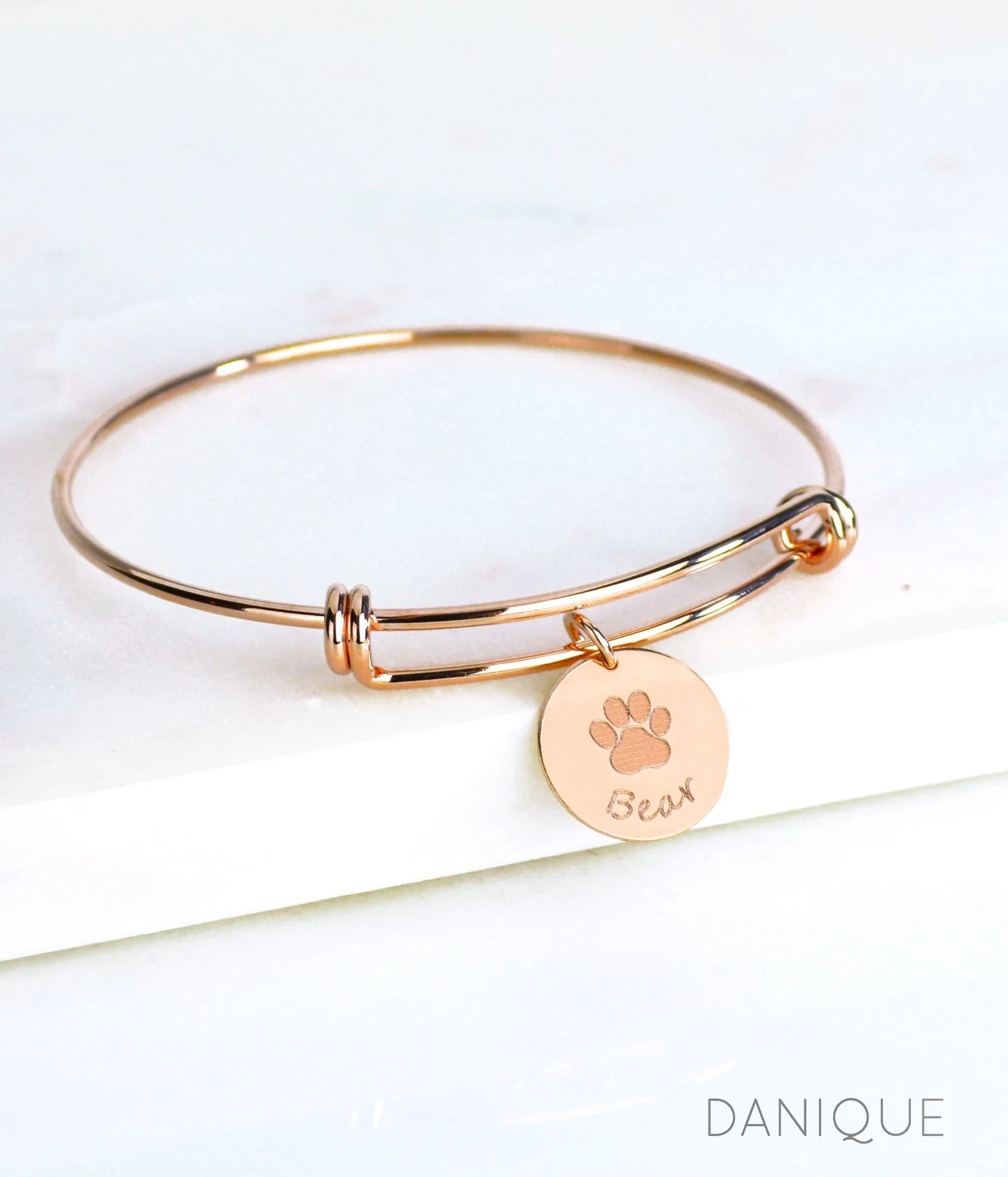 Rose gold filled bangle with paw print and name engraved disc charm