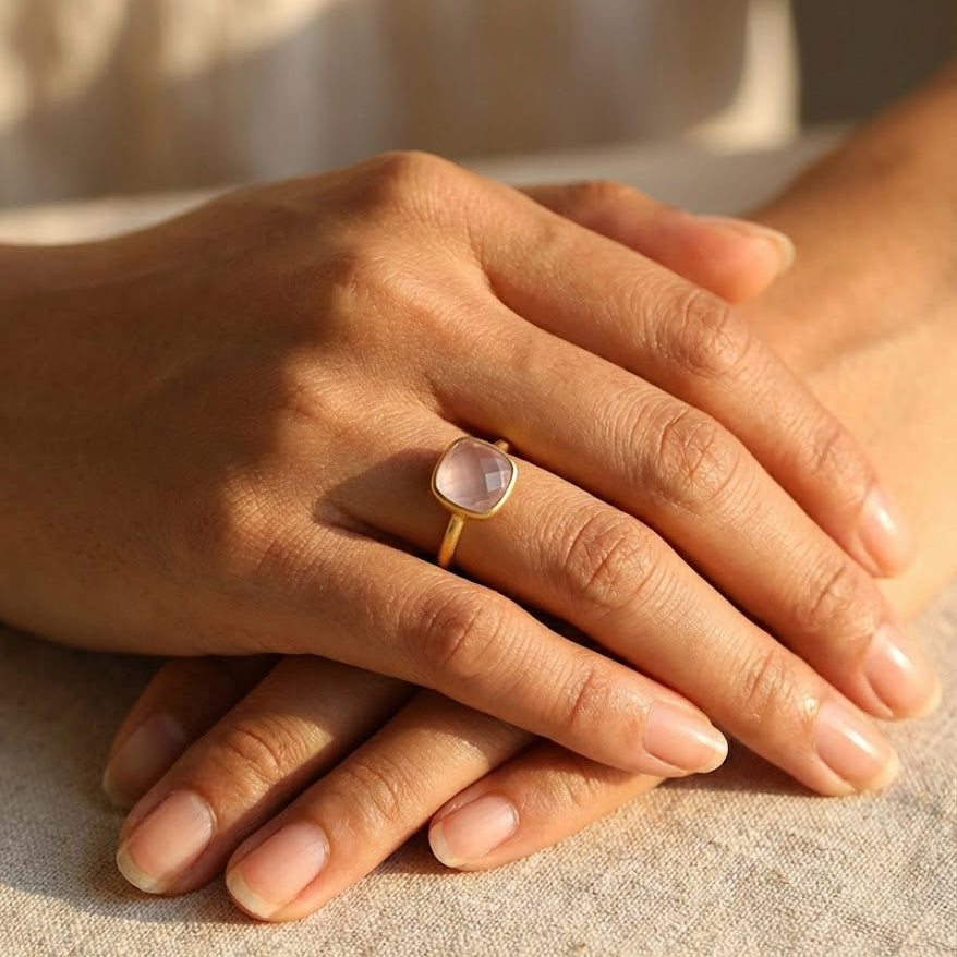 Cushion cut birthstone ring collection including pink chalcedony October ring, gold gemstone jewelry in multiple colors