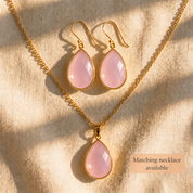 Pink Chalcedony teardrop earrings with coordinating pink gemstone pendant necklace in gold.
