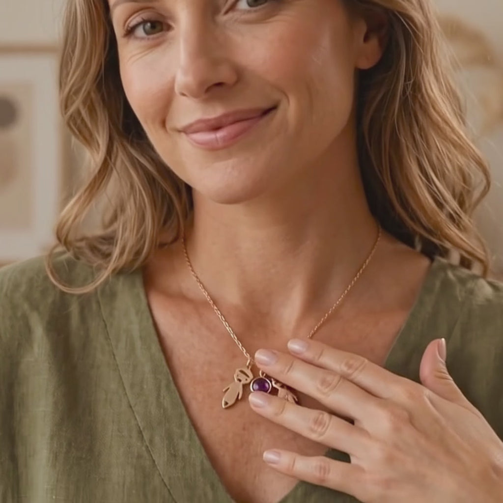 A video showcasing Personalized mom necklace with two engraved child charms and birthstone pendants on a rose gold chain.