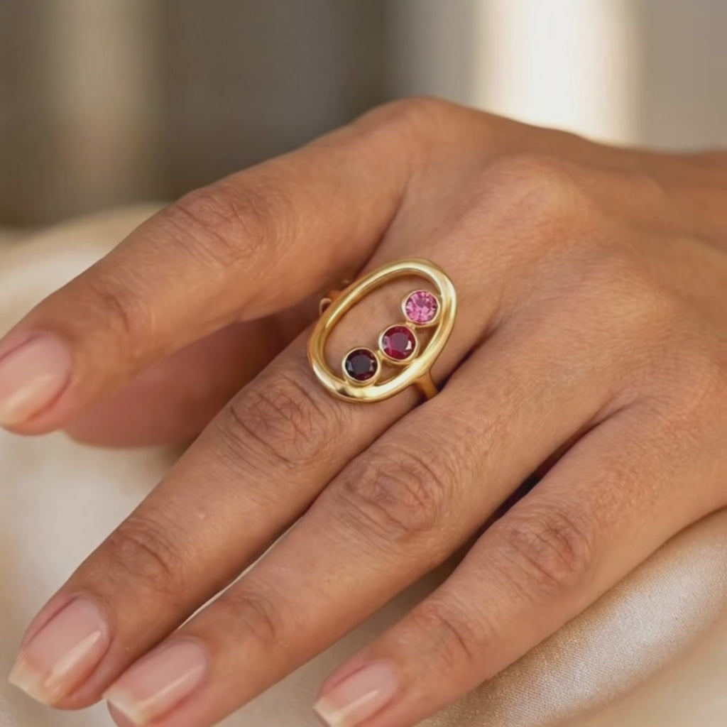 A video showcasing mom ring with three custom birthstones. Birthstones available for January, February, March, April, May, June, July, August, September, October, November, December. 