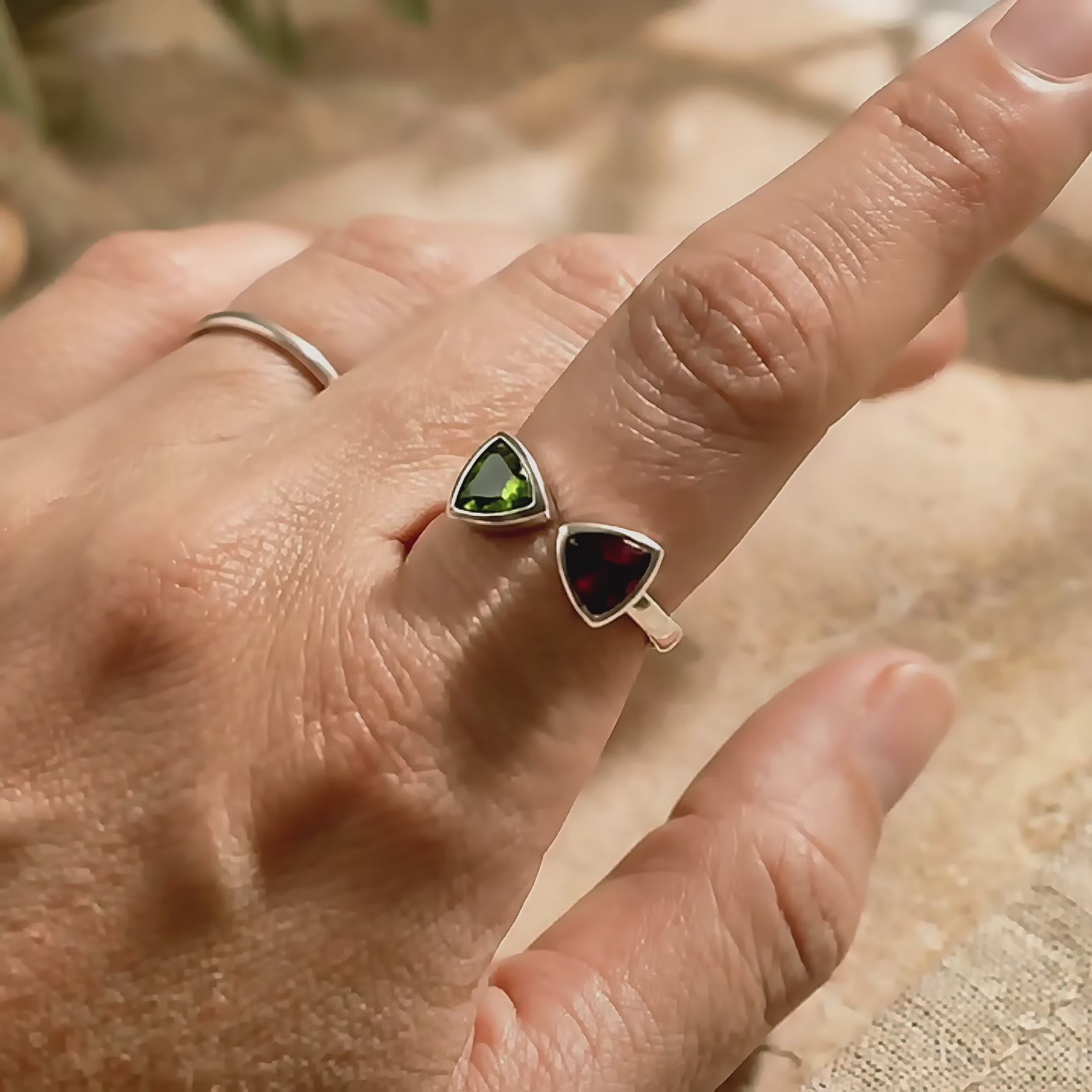 Video showcasing custom two stone birthstone rings in gold, featuring colorful gemstone pairs including amethyst, aquamarine, peridot, and garnet, designed as personalized mother rings, family rings, or meaningful couples jewelry gifts.