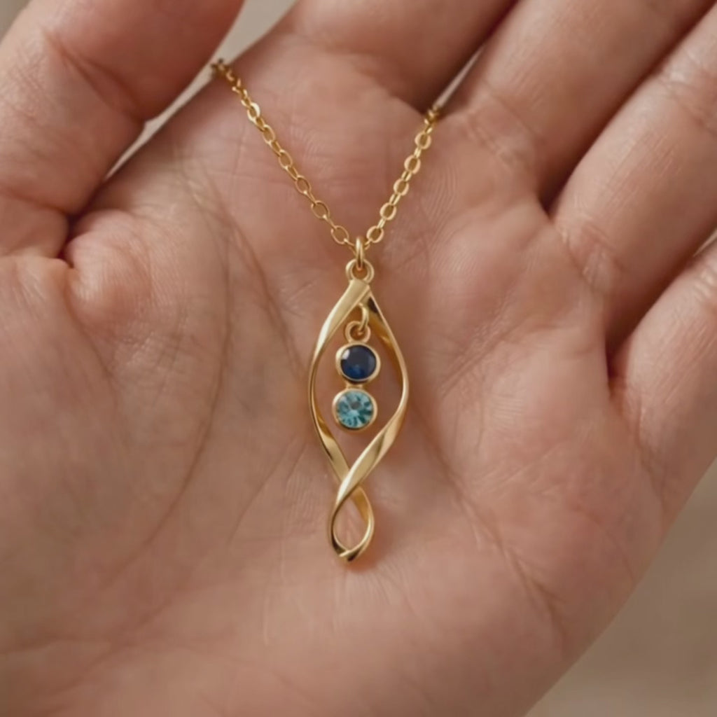A video showcasing a Gold or sterling silver twist birthstone necklace for mom with up to three gemstones minimalist family necklace