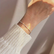 Gold morse code bead bracelet with pearl spacers. delicate bracelets, gold and silver, with small beads spaced evenly along the length of each bracelet. Pinky promise. Morse code bead jewelry, morse code beaded jewelry, secret message jewelry, bff jewelry, bff bracelet, pinky promise bracelet, secret message bracelet, hidden message jewelry, hidden message bracelet, sterling silver, gold, adjustable bracelets, delicate bead bracelet, new product, delicate pattern of dots and dashes bracelet