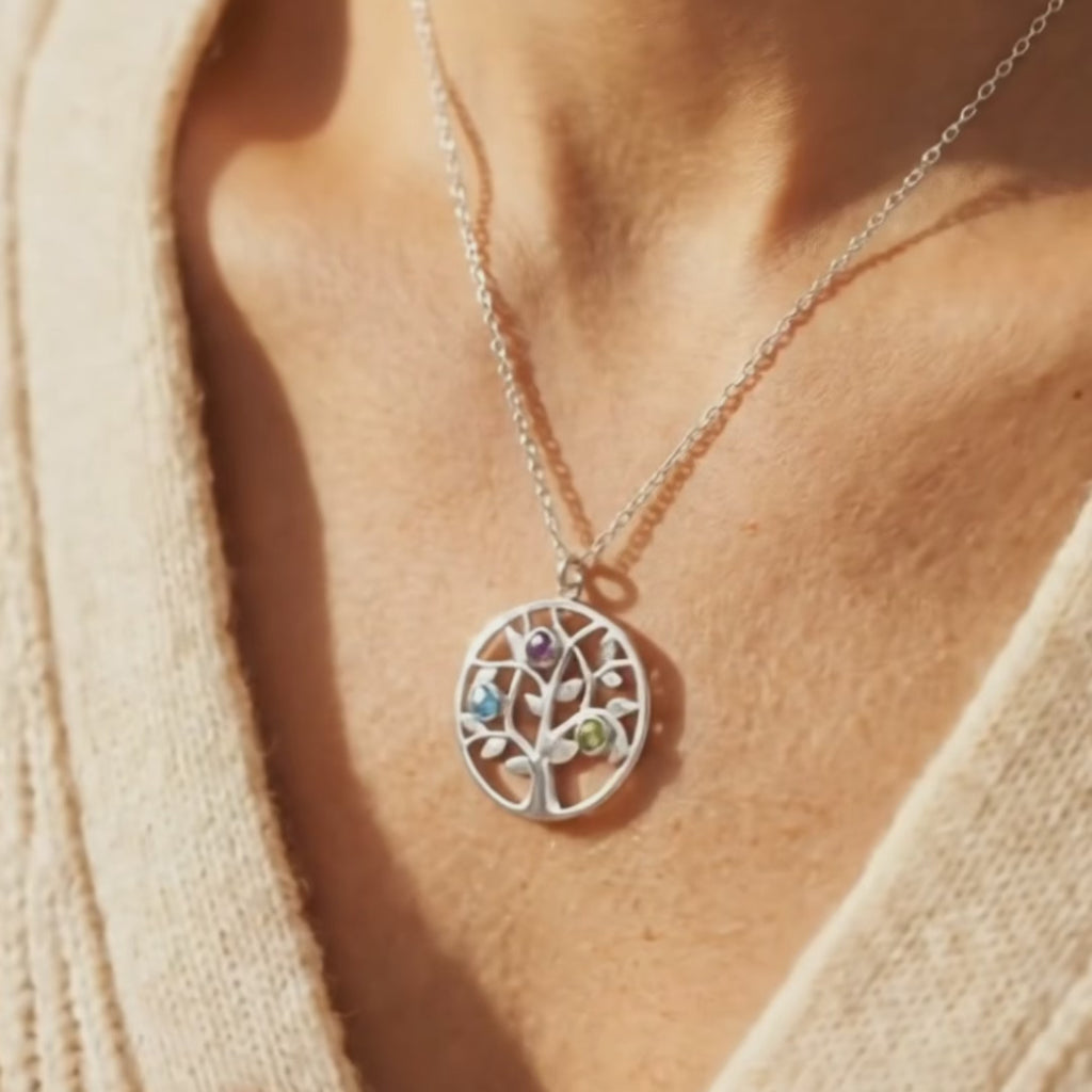 Close up of custom birthstone mom necklace on model, family tree necklace with colorful birthstones, personalized tree of life pendant for mom, elegant everyday birthstone necklace, meaningful mother jewelry gift, minimalist family necklace for women, personalized birthstone pendant in sterling silver, yellow gold, or rose gold, Mother’s Day jewelry, custom family keepsake necklace, gift for mom with children’s birthstones