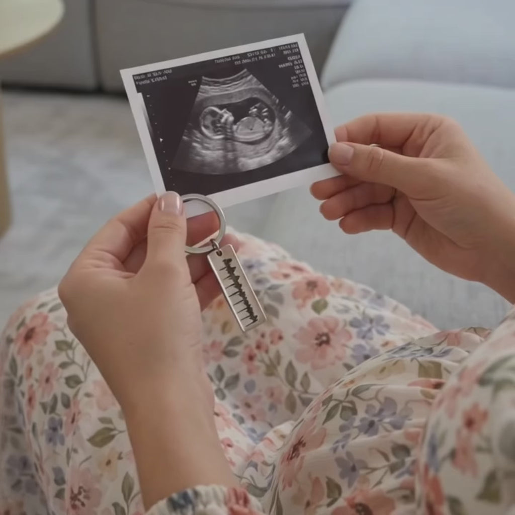 video showcasing a Personalized baby keychain, sonogram keychain, engraved baby keychain  custom engraved in gold, black or silver