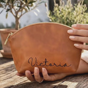 Personalized natural leather cosmetic bag for women with monogram initials—handmade zip pouch with durable lining and Italian zipper; customizable engraving, travel makeup bag, bridesmaid or mom gift, gift-ready by Danique Jewelry.