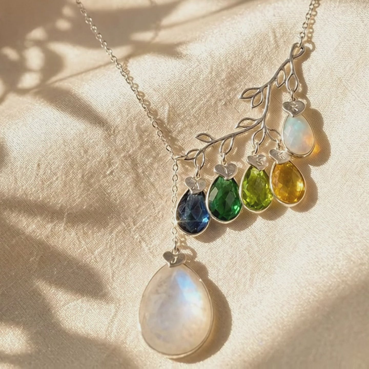 A video showcasing family tree birthstone necklace for mom gold branch necklace with multiple gemstones