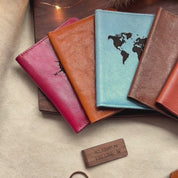 A pan over shot of personalized leather passport holders, engraved money clips, and custom travel supplies. Custom engraved passport covers and luggage tags are available as individuals or sets. The perfect gift for travelers, personalized gifts for honeymoon, handmade leather travel accessories for couples and families.