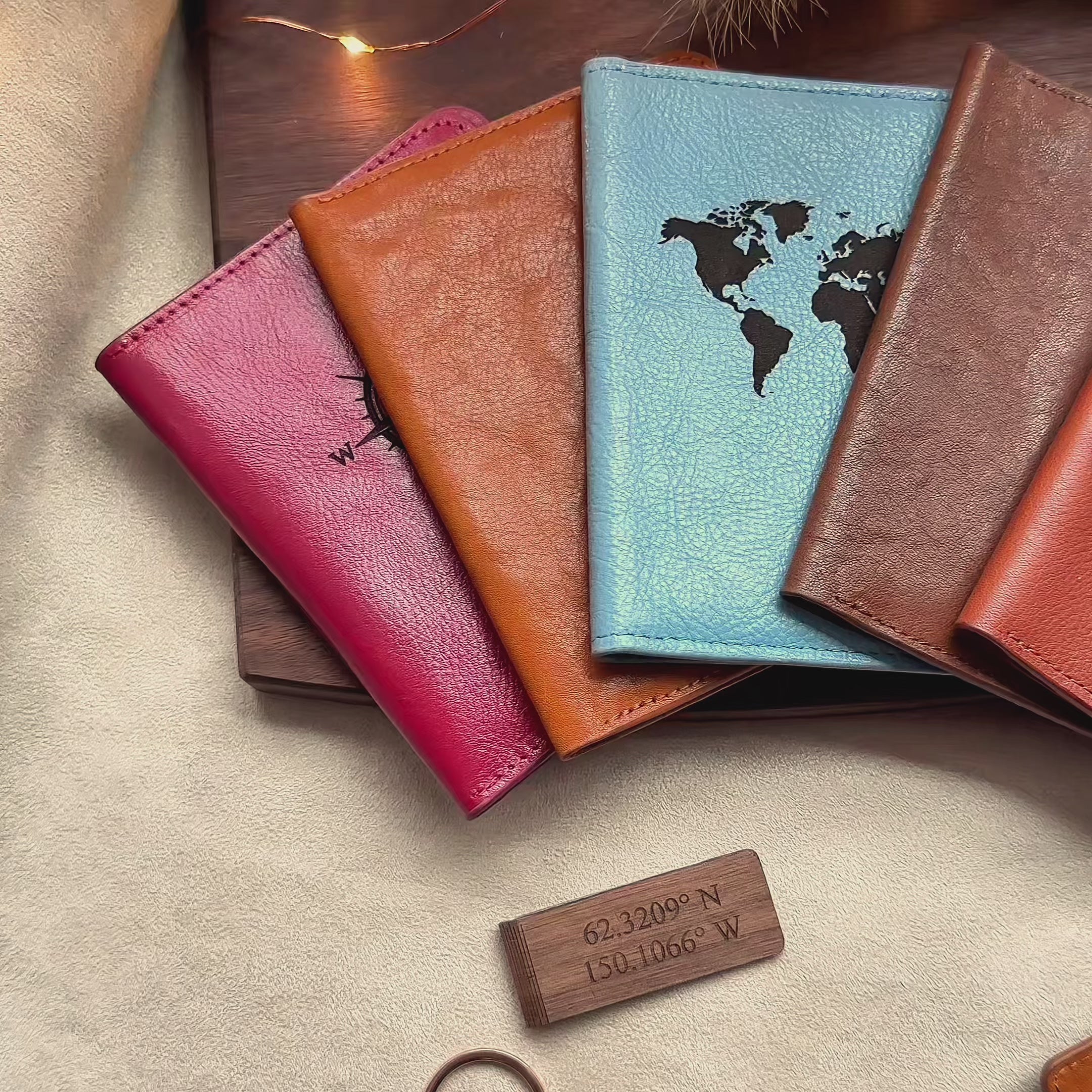 A pan over shot of personalized leather passport holders, engraved money clips, and custom travel supplies. Custom engraved passport covers and luggage tags are available as individuals or sets. The perfect gift for travelers, personalized gifts for honeymoon, handmade leather travel accessories for couples and families.