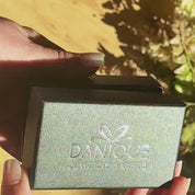 A person opens a black Danique box revealing engraved silver cufflinks and a tie clip. A set of gold and silver cufflinks rotates. A person wearing gold square cufflinks adjusts their sleeves. A gold stainless steel tie clip is hooked to a blue spotted tie. A still photo of a set of engraved gold round and tie bar groomsmen gifts. Engraved Initials, Name, Monogram, Handwriting, Coordinates. Black stainless steel, silver stainless steel, gold stainless steel tie clip.