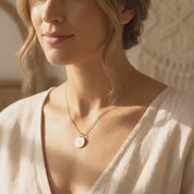 A video showcasing a Personalized state map necklace with heart marking hometown in yellow gold