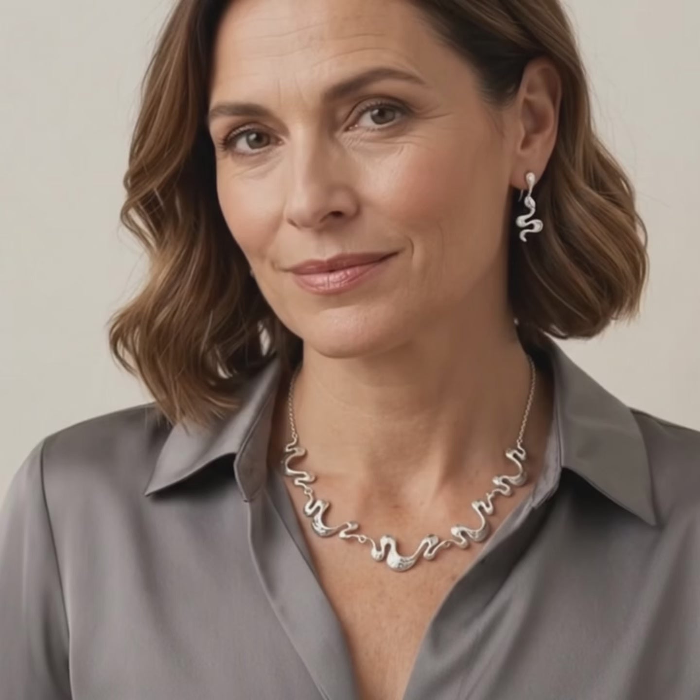 video showcasing gold boho wave necklace with matching earrings styled as modern statement jewelry