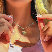 Close-up of a custom birthstone sun pendant necklace held on a delicate gold chain, featuring a radiant sunburst charm with a personalized gemstone center, minimalist celestial birthstone jewelry for women, meaningful gift for mom, daughter, or girlfriend, perfect for Valentine’s Day, birthday, or everyday layering necklace