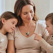 a video showcasing Personalized birthstone necklace for mom with cascading teardrop gemstones and initial charms, a custom family necklace representing children or grandchildren.