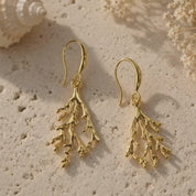 A video showcase of bohemian gold coral dangle earrings. 