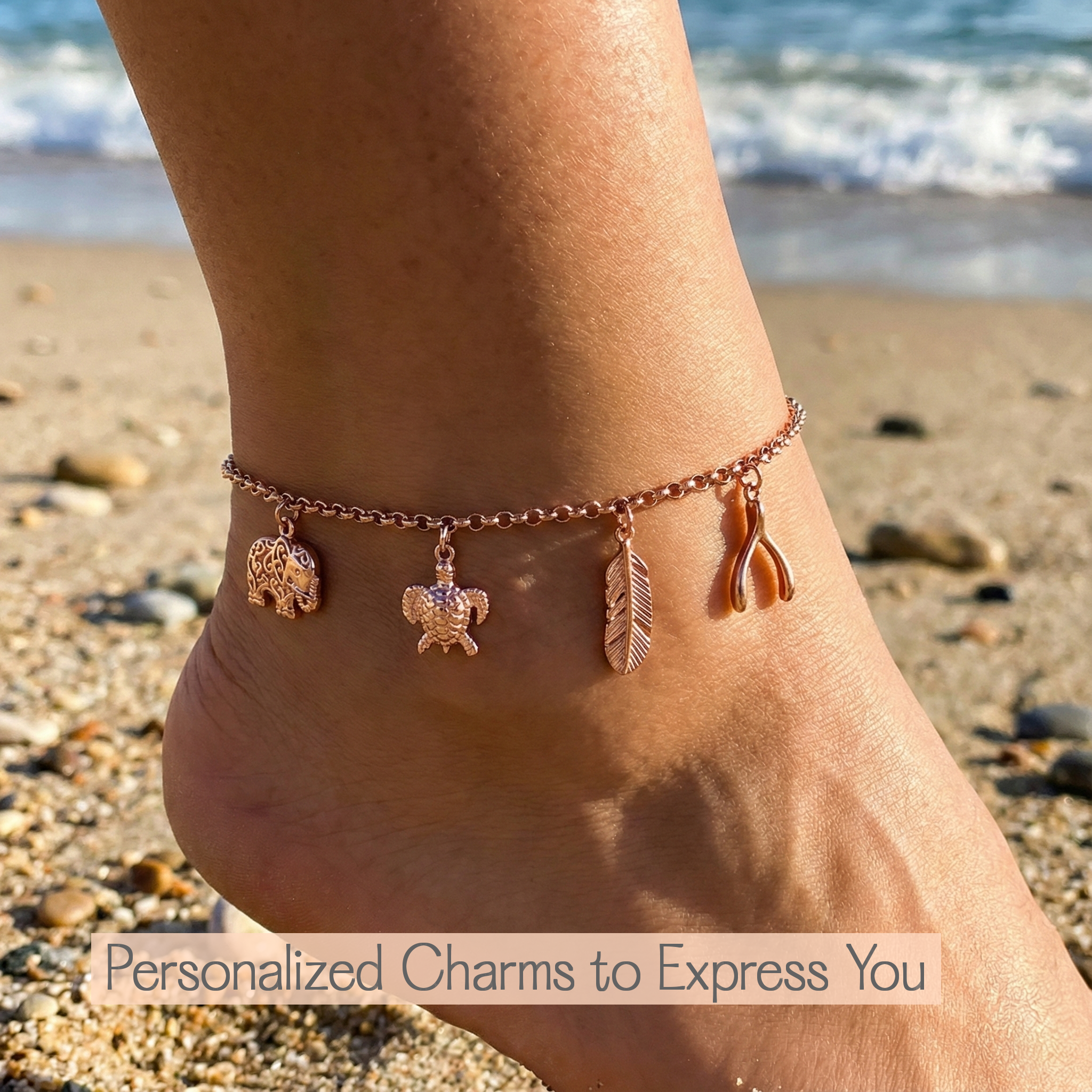 A rose gold charm anklet rests elegantly against a neutral textile background, showcasing the craftsmanship and delicate detailing that define this lightweight, custom jewelry piece designed for comfort and everyday elegance.