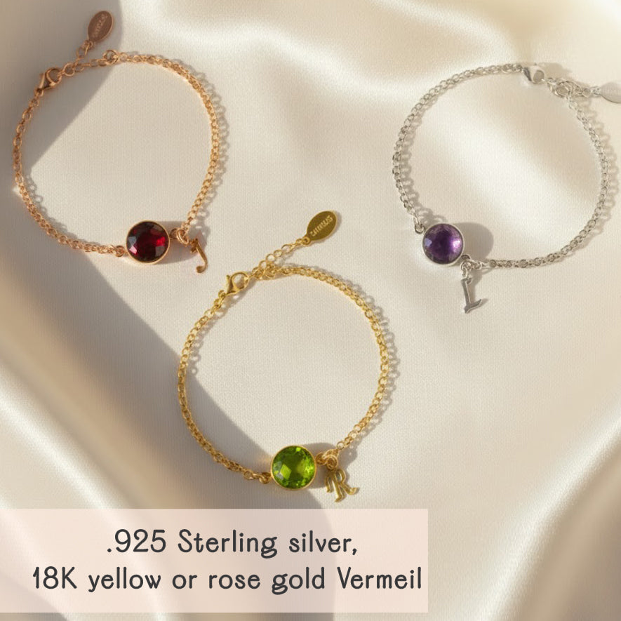 Set of personalized birthstone initial bracelets in rose gold vermeil, yellow gold vermeil and sterling silver, each featuring bezel-set round gemstones for January, August and February paired with dainty initial charms. Displayed on soft satin for a luxurious look, these custom birthstone bracelets make thoughtful gifts for moms, grandmas, daughters, bridesmaids or best friends. Perfect for birthdays, Mother’s Day, Christmas and wedding party gifts.