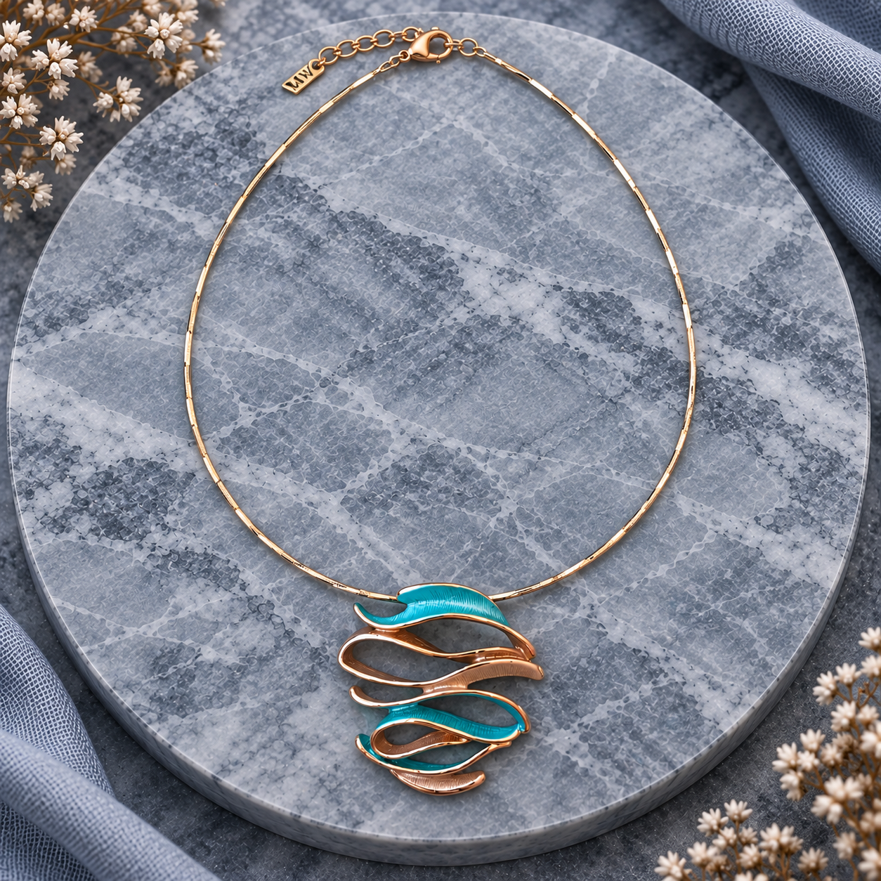Full Ocean Breeze Sculptural Wave pendant necklace with adjustable chain on gray stone
