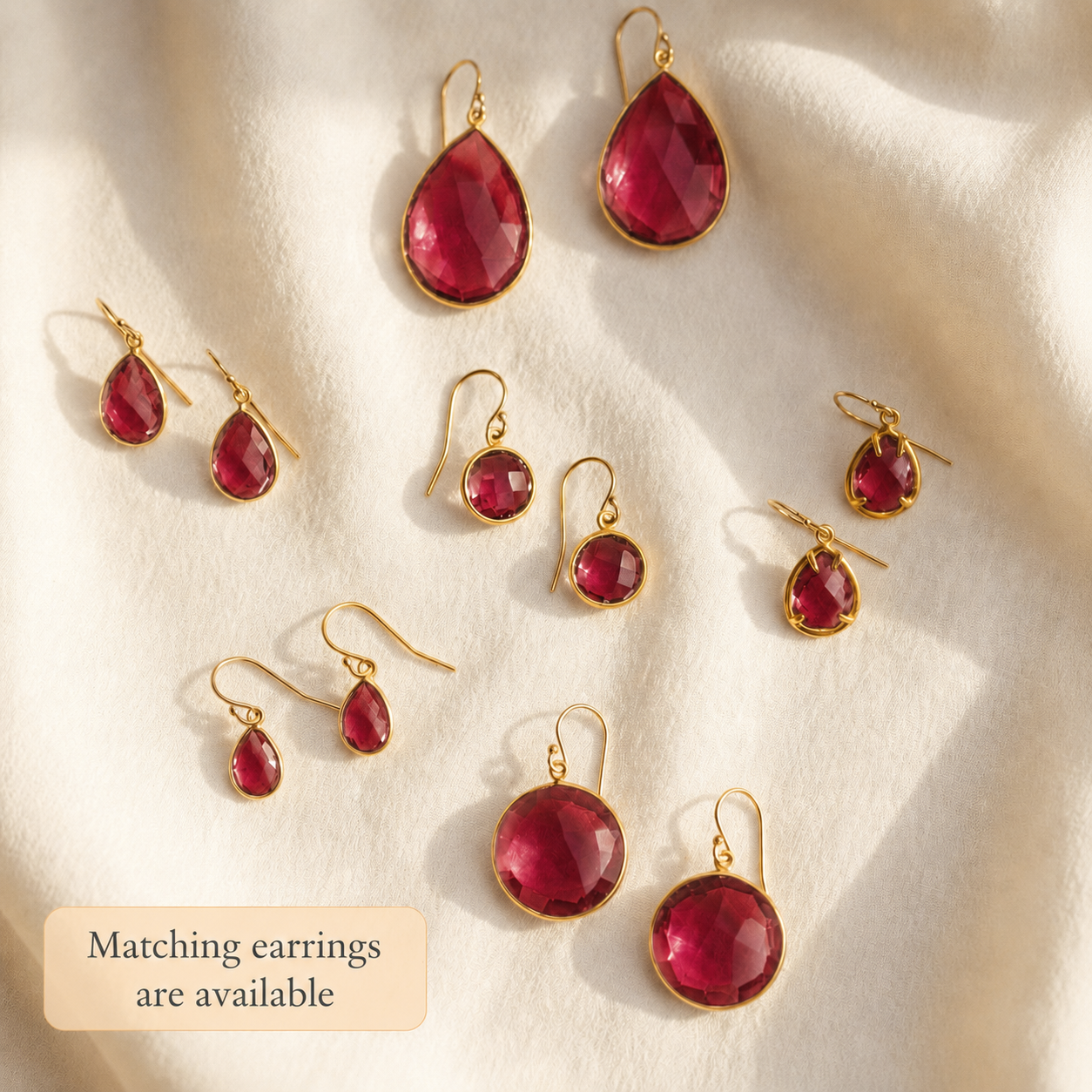 Ruby quartz matching earrings and necklace set shown as coordinating July birthstone jewelry.