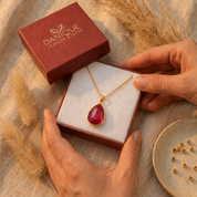 Ruby quartz pendant necklace displayed in Danique Jewelry gift box for ready-to-gift packaging.