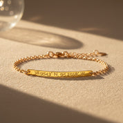Custom coordinates bar bracelet photographed on neutral background, engraved skinny bar bracelet with latitude and longitude coordinates, personalized location bracelet crafted in gold filled metal, minimalist dainty bar bracelet design, custom engraved bracelet for travel memories, wedding location, or special place, elegant everyday jewelry gift for women, clean product photography highlighting crisp engraving