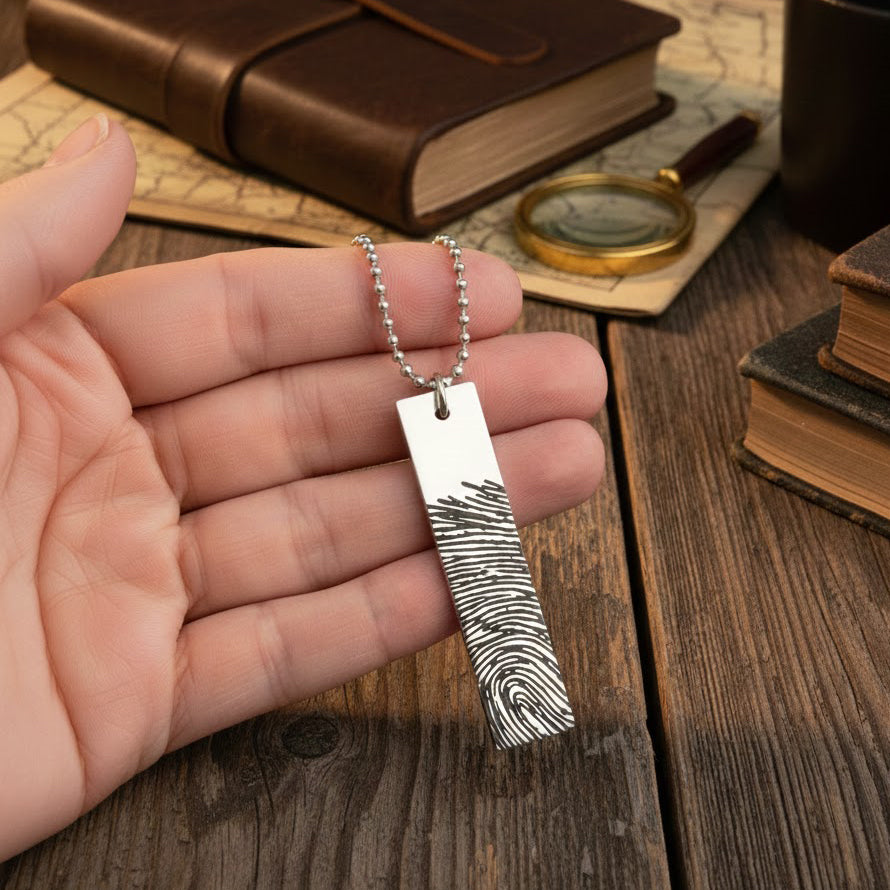 One silver rectangle military necklace with finger print from photo to memorialize a friend or family member. 