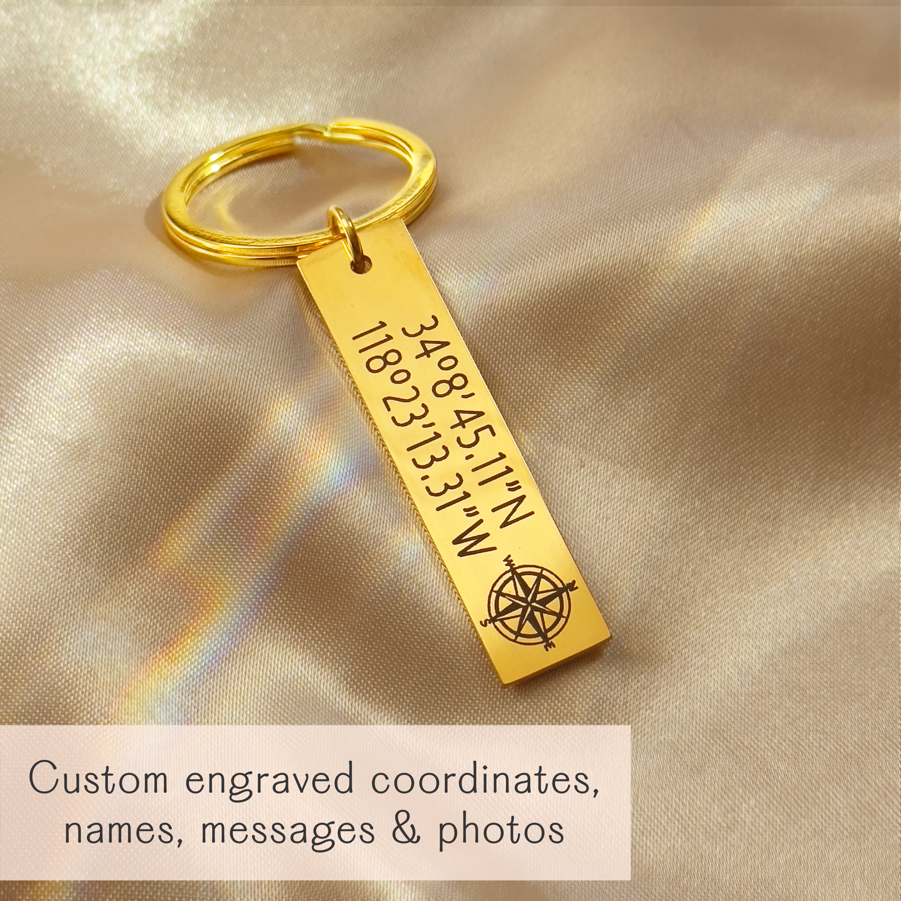 Gold stainless steel bar keychain engraved with GPS coordinates and compass icon on champagne satin, custom location keyring for anniversary or long distance relationship
