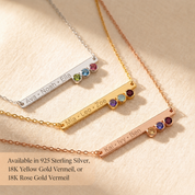 Birthstone bar necklace shown in silver, yellow gold, and rose gold metal finishes