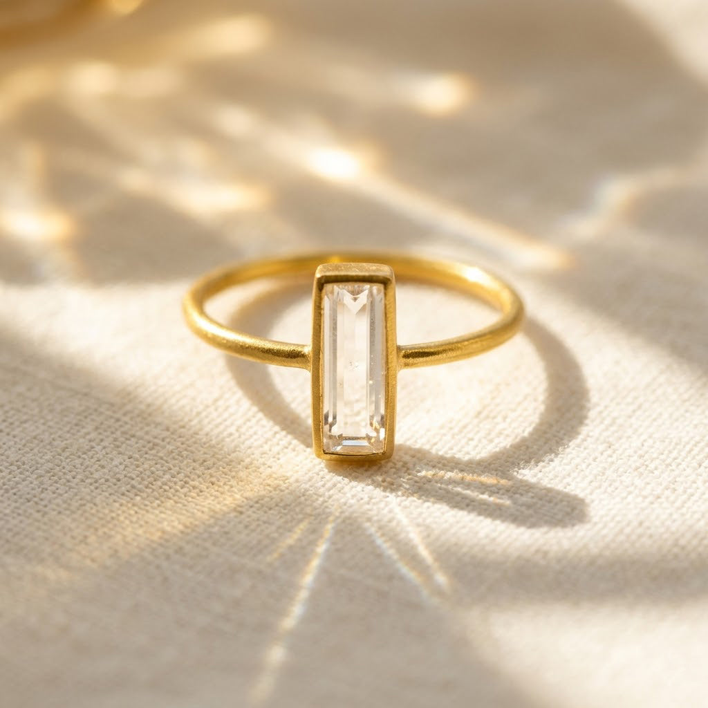 Clear quartz bar ring in gold vermeil, faceted rectangle April birthstone stacking ring