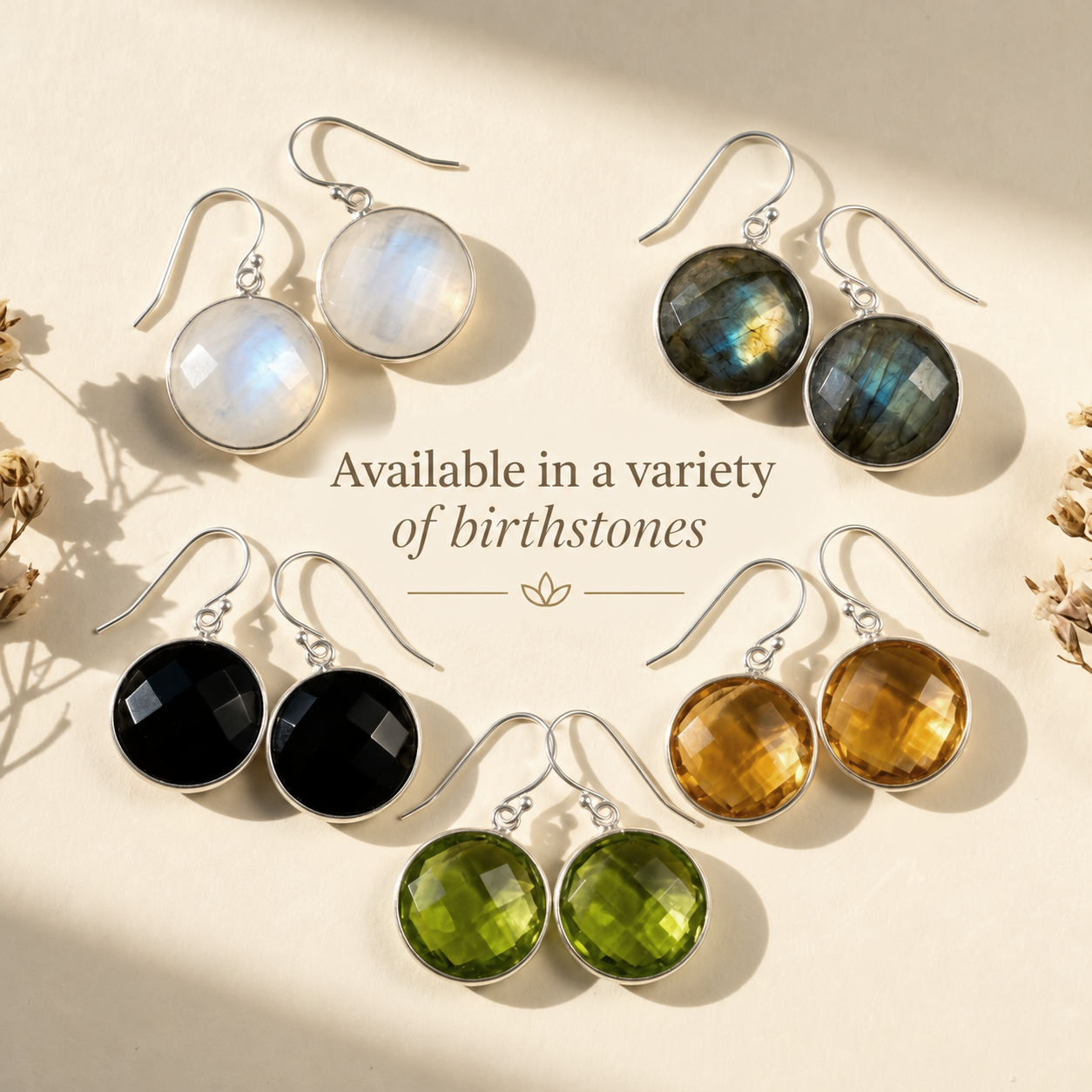 Large round faceted Smoky Quartz drop earrings in yellow gold displayed in warm natural light.
